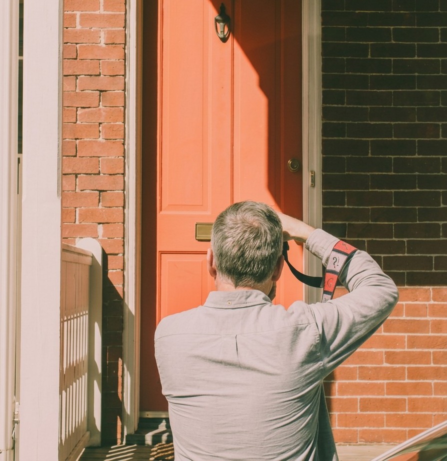 Sullivan Home Inspector examining a front door
